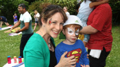 Mom and son hug with face paint