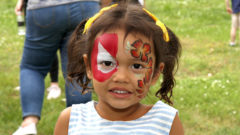young girl with face paint