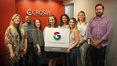 Crosby Team holding Google Premier Partner Sign