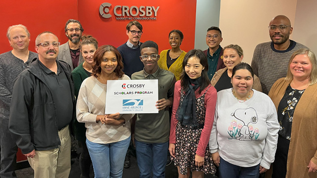 Crosby scholars and staff gather in office space for photo